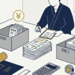 机の上に領収書の束を表すイメージ